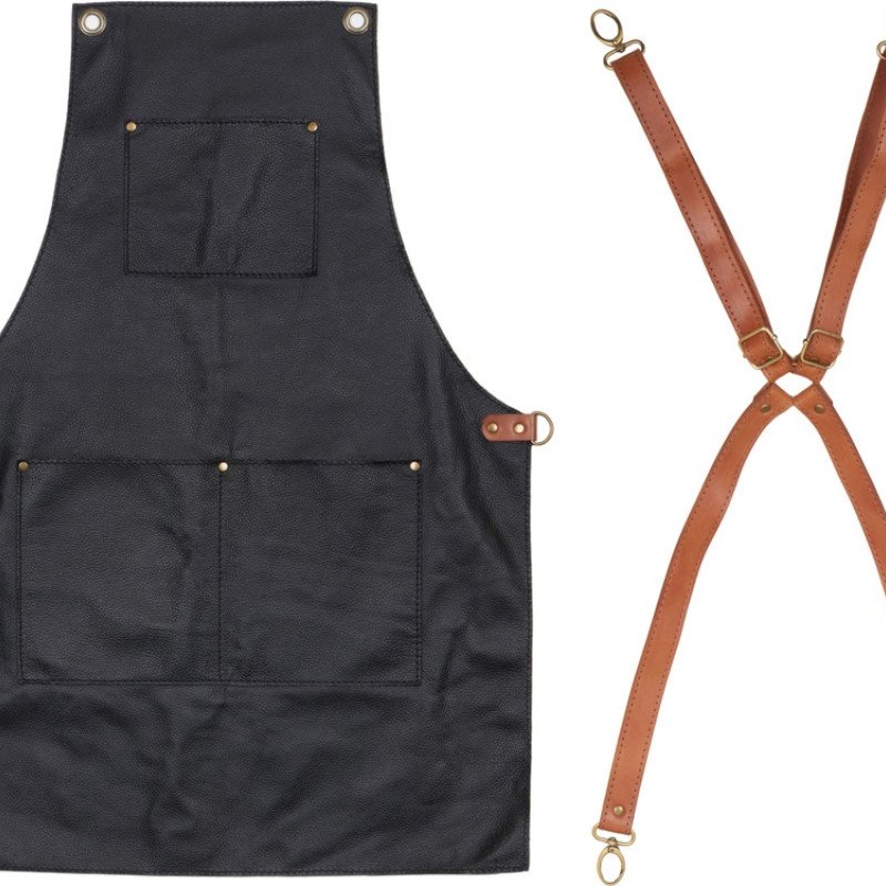 Фартук из натуральной кожи флотер  Материал: натуральная кожа КРС, цвет фартука: черный, цвет ремней: светлый бук, фурнитура из металлического сплава ЦАМ, цвет фурнитуры: антик, размер универсальный